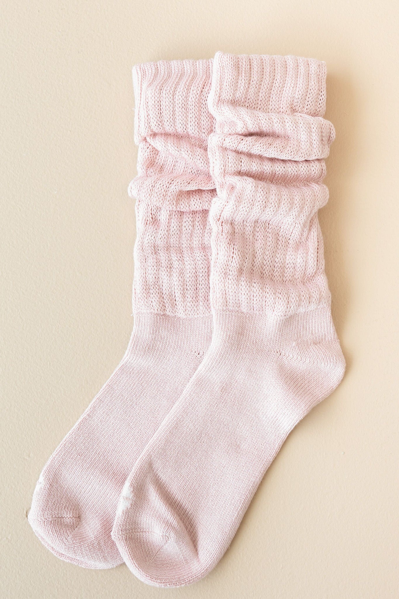 Flat lay of Kyte Scrunch Socks in Blush 