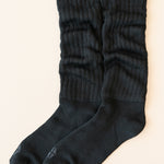 Flat lay of unfolded Scrunch Socks in Midnight