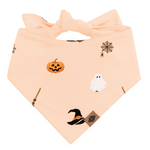Halloween-themed bandana with pumpkins, ghosts, and witch hats on a peach background