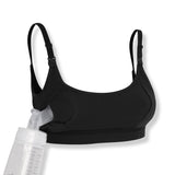 black pumping and nursing bra with a clear pumping bottle on a white background