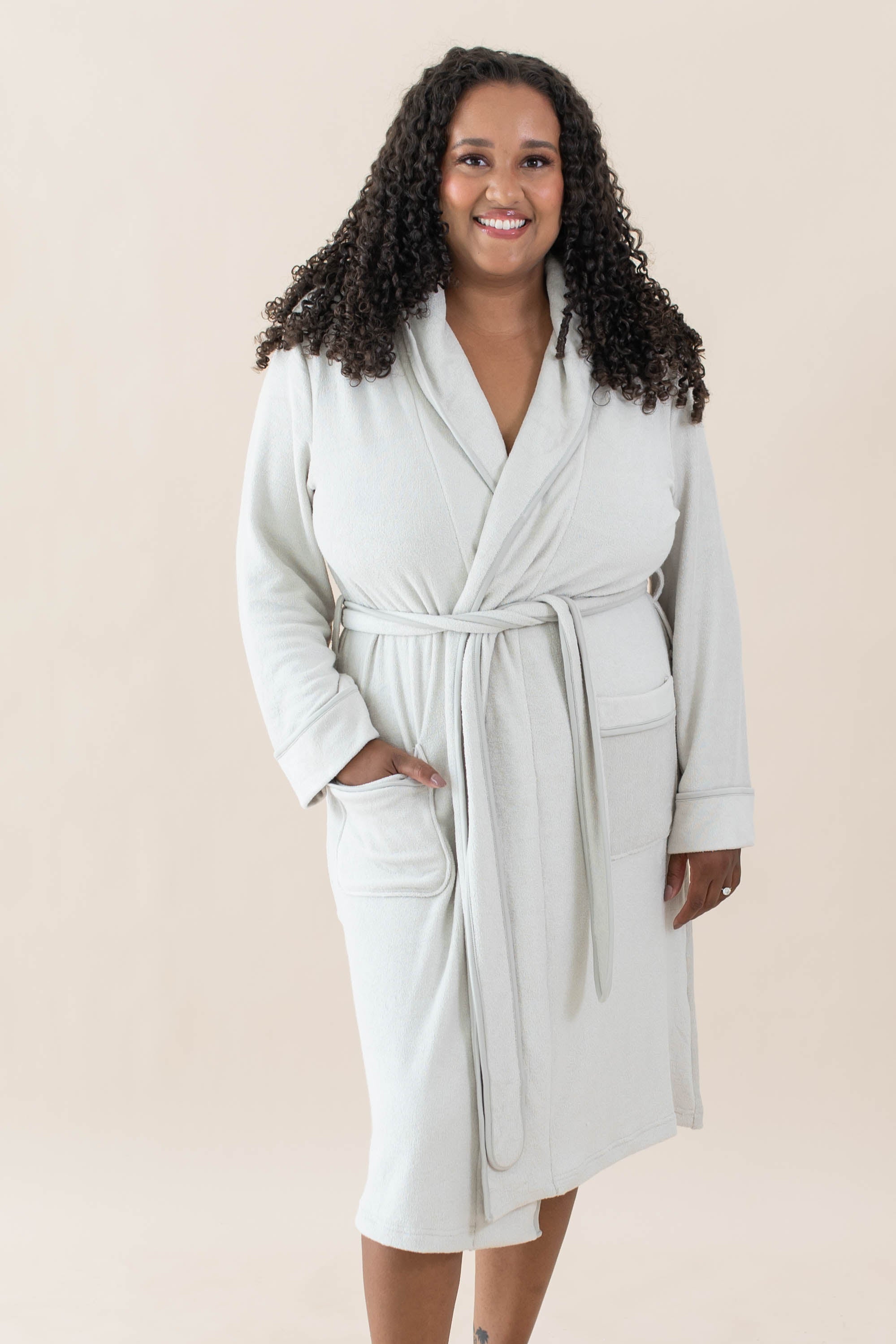 Model wearing the Adult Robe in Oat with one hand in pocket