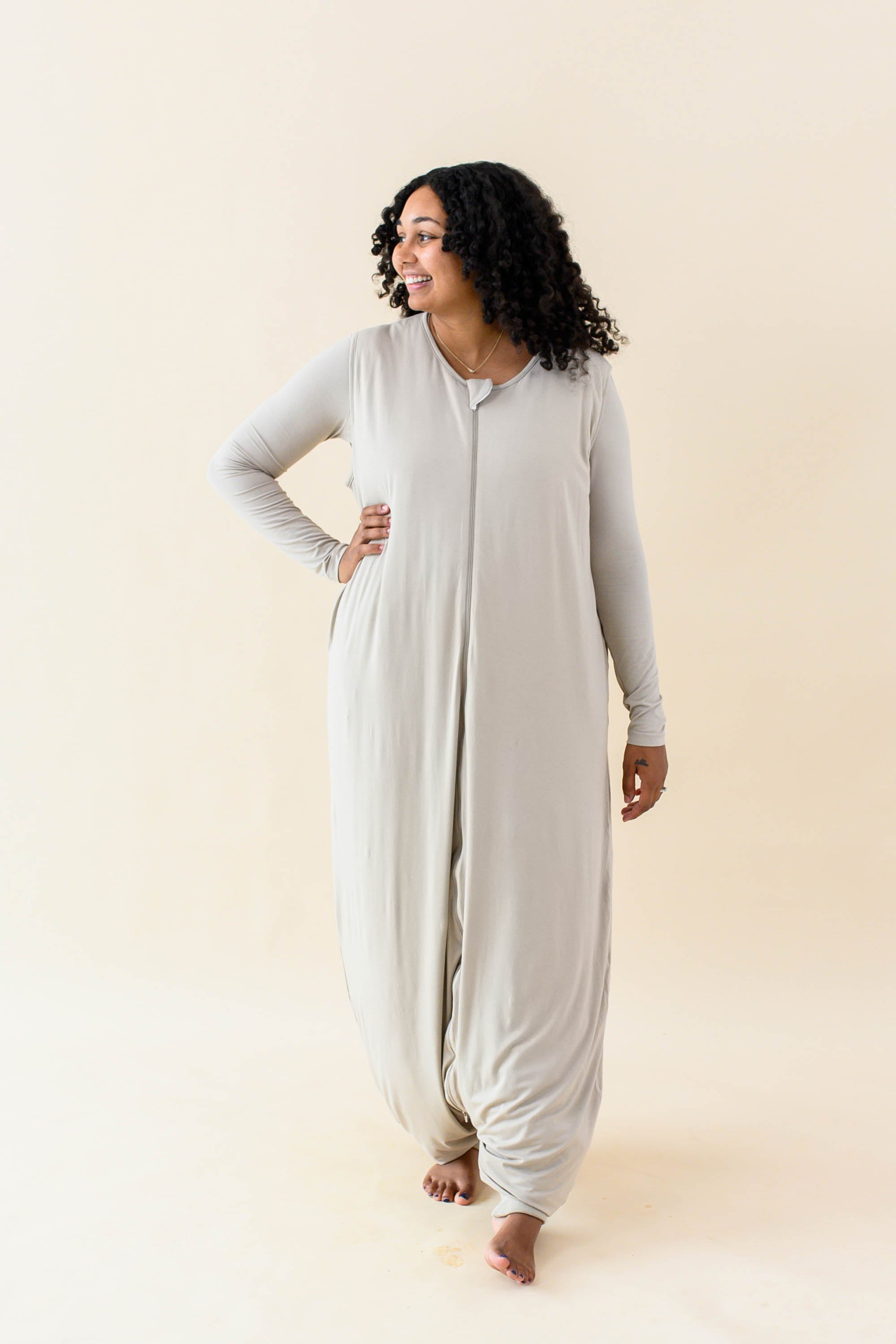 Female model wearing the Adult Sleep Bag Walker in Almond