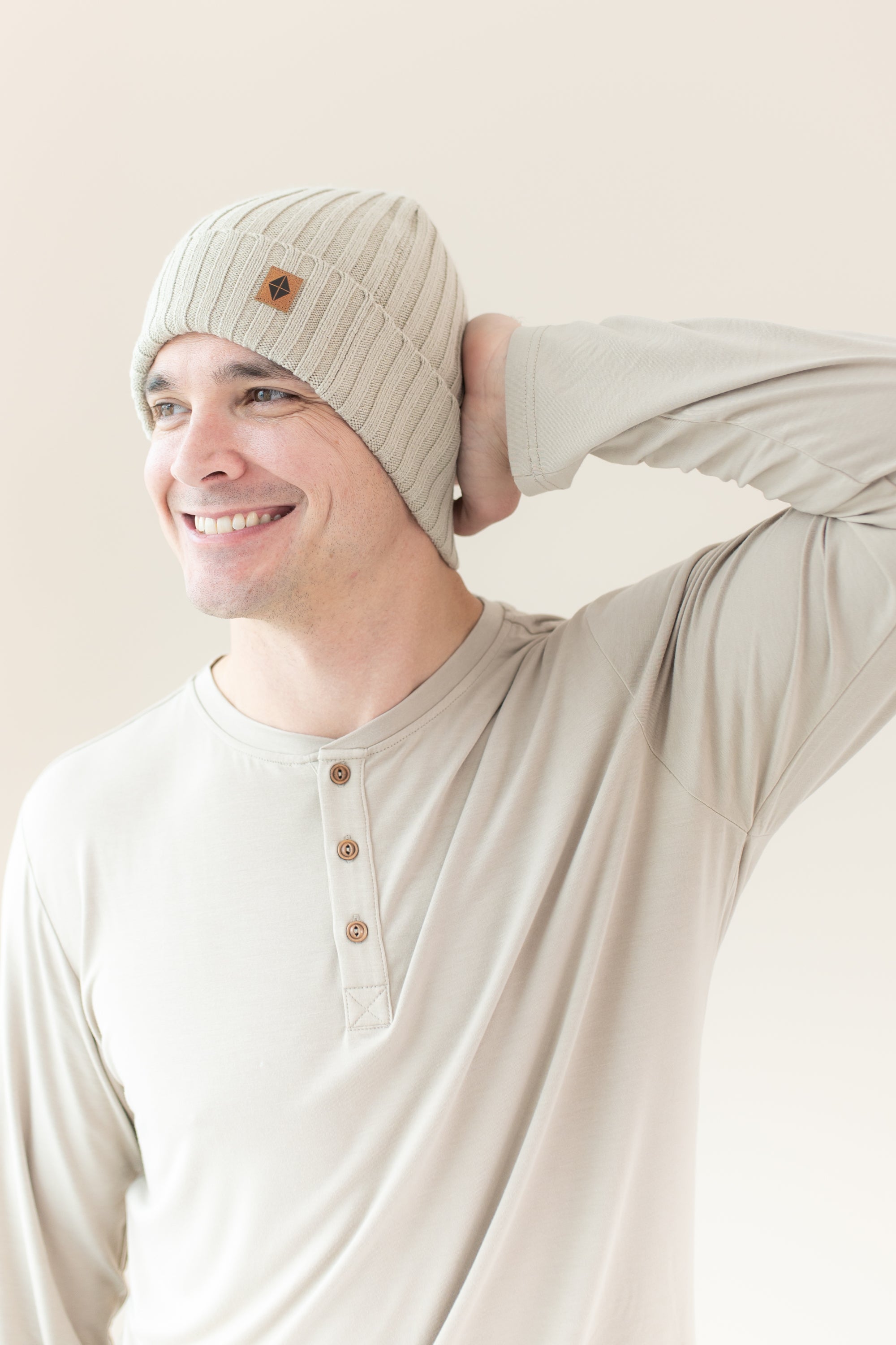 Man modeling Chunky Knit Ribbed Beanie in Almond