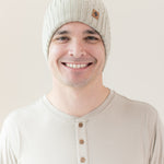 Man modeling Chunky Knit Ribbed Beanie in Almond close up