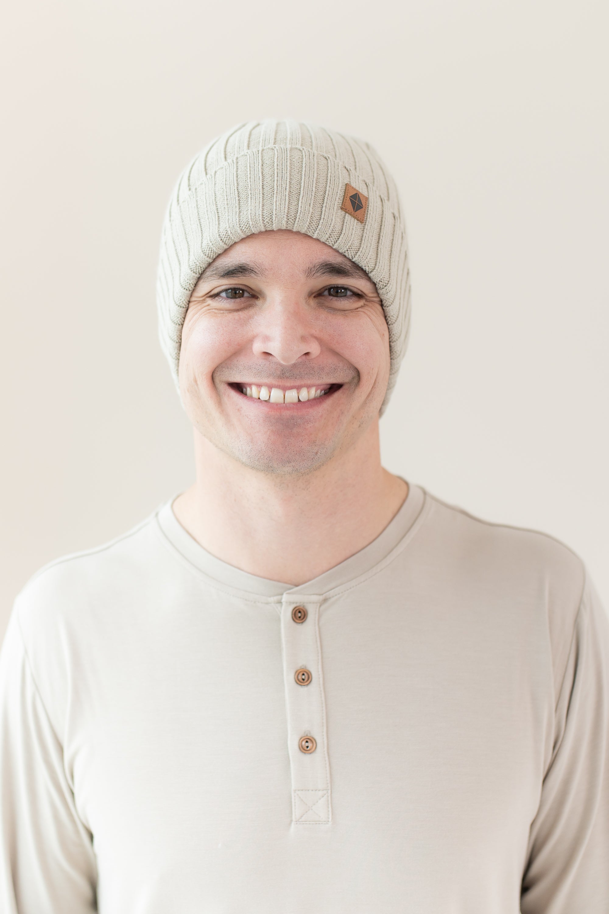 Man modeling Chunky Knit Ribbed Beanie in Almond close up