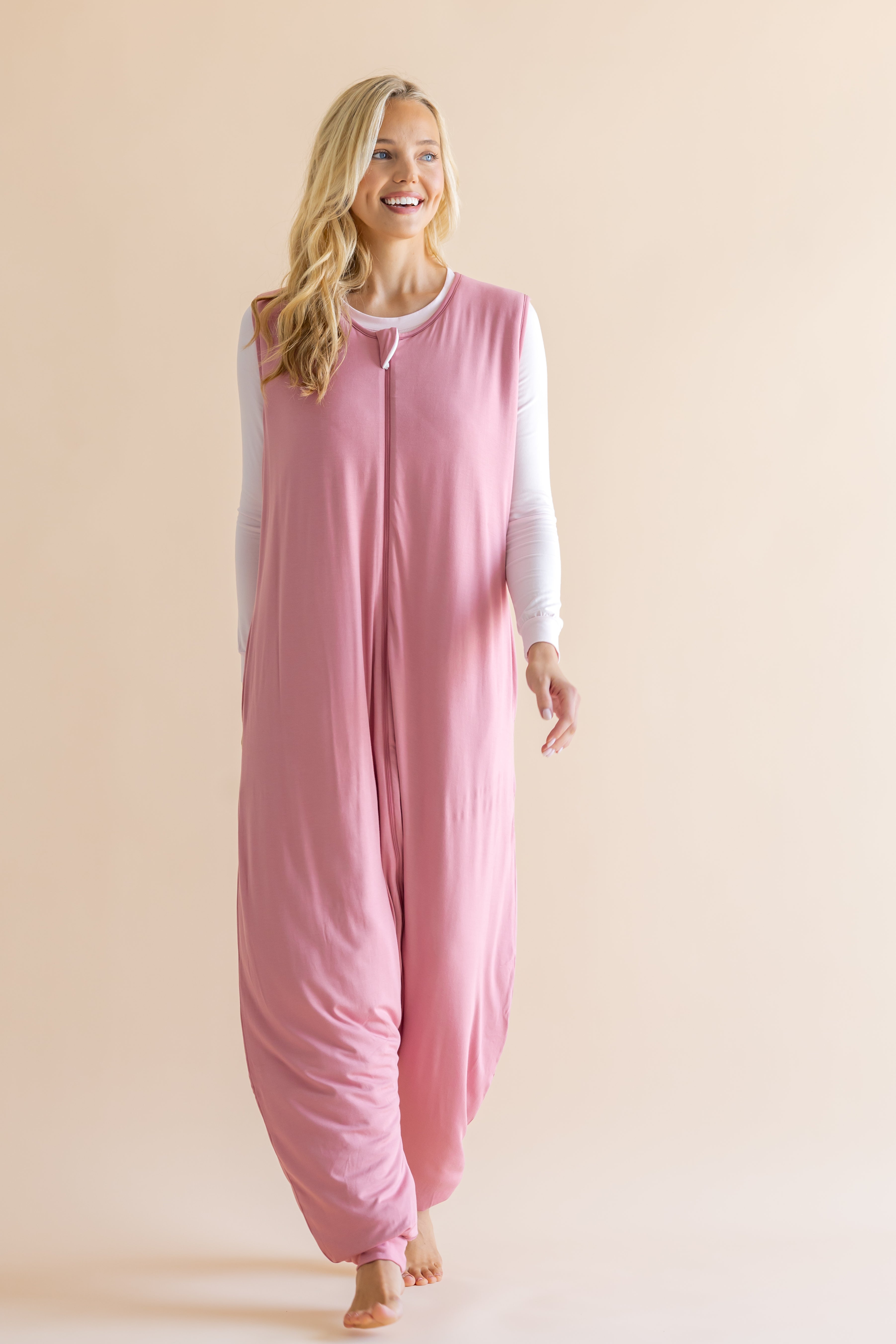 Smiling model looking to the side walking while wearing the Adult Sleep Bag Walker in Apple Blossom

::: Model is 5'9" wearing size S ///