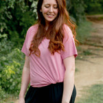 Female wearing the Women's Crew Neck Tee in Apple Blossom paired with black jeans