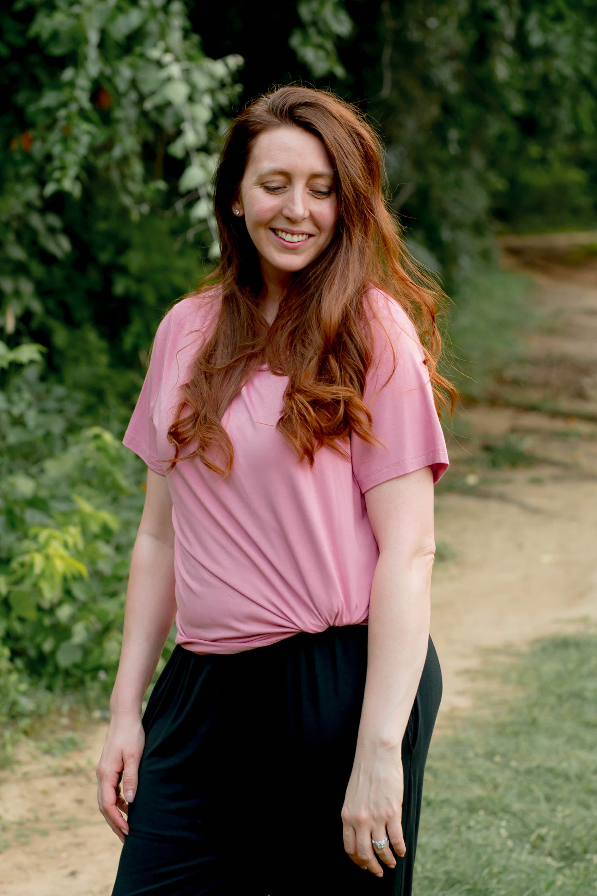 Female wearing the Women's Crew Neck Tee in Apple Blossom paired with black jeans