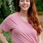 Female model wearing the Women's Crew Neck Tee in Apple Blossom