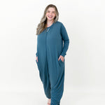 Smiling model wearing the Adult Sleep Bag Walker in Atlantic with her hands in her pocket