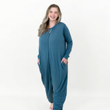 Smiling model wearing the Adult Sleep Bag Walker in Atlantic with her hands in her pocket