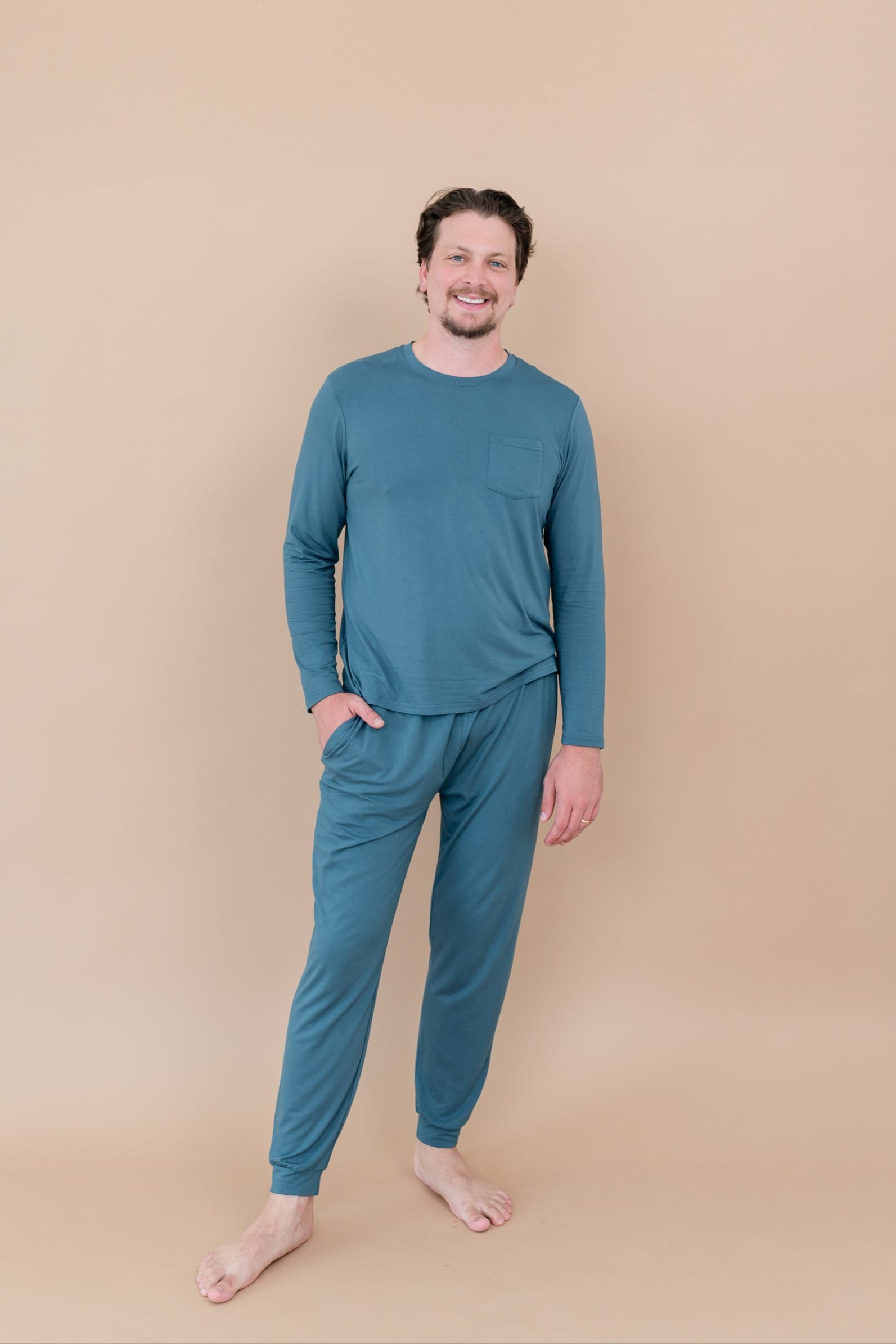 Smiling male model wearing Men's Jogger Set in Atlantic