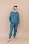 Smiling male model wearing Men's Jogger Set in Atlantic