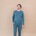 Male model standing with hand in pocket while wearing Men's Jogger Set in Atlantic