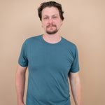 Male model wearing Men's Crew Neck Tee in Atlantic and matching lounge pants