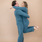 Man wearing the Men's Lounge Pants in Atlantic while holding smiling woman in matching pajama set 