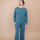 Male model wearing the Long Sleeve Henley Top in Atlantic and matching Lounge Pants