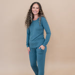Smiling wearing the Women's Jogger Set in Atlantic with hand in pocket
