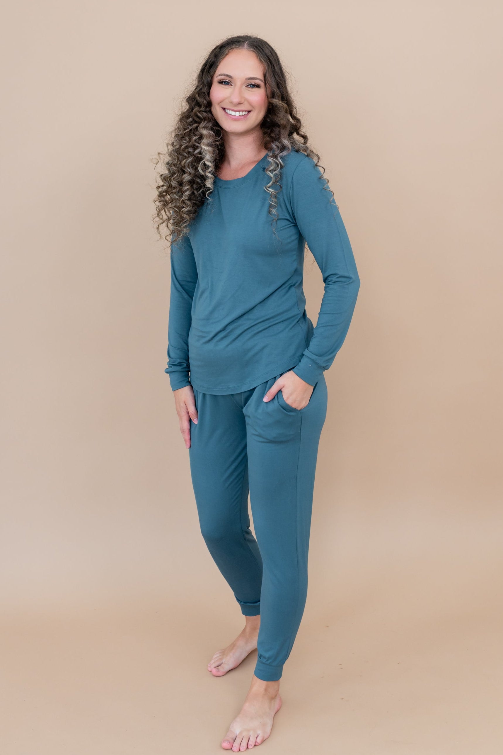 Smiling wearing the Women's Jogger Set in Atlantic with hand in pocket