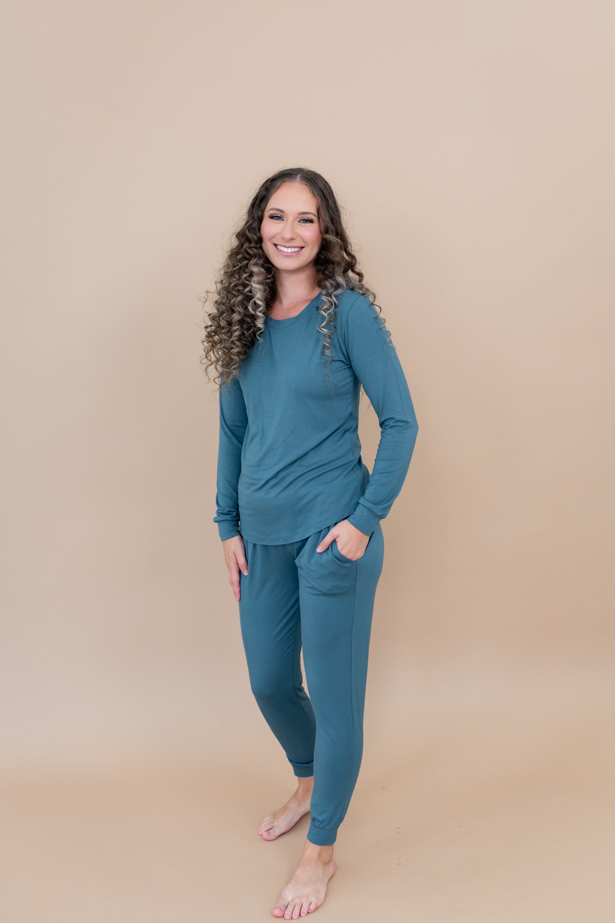 Smiling wearing the Women's Jogger Set in Atlantic with hand in pocket