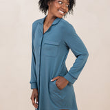 Woman smiling to the side while modeling the Women's Sleep Shirt in Atlantic