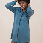 Model with  hands in hair while wearing the Kyte  Women's Sleep Shirt in Atlantic