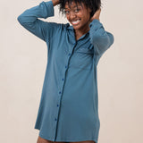 Model with  hands in hair while wearing the Kyte  Women's Sleep Shirt in Atlantic