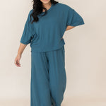 Women with hand on hip modeling the Wide Leg Pant Set in Atlantic