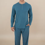Smiling model wearing Men's Lounge Pants in Atlantic and matching Long Sleeve Henley Top 