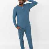 Male model wearing the Men's Ribbed Henley Set in Atlantic with one hand on head