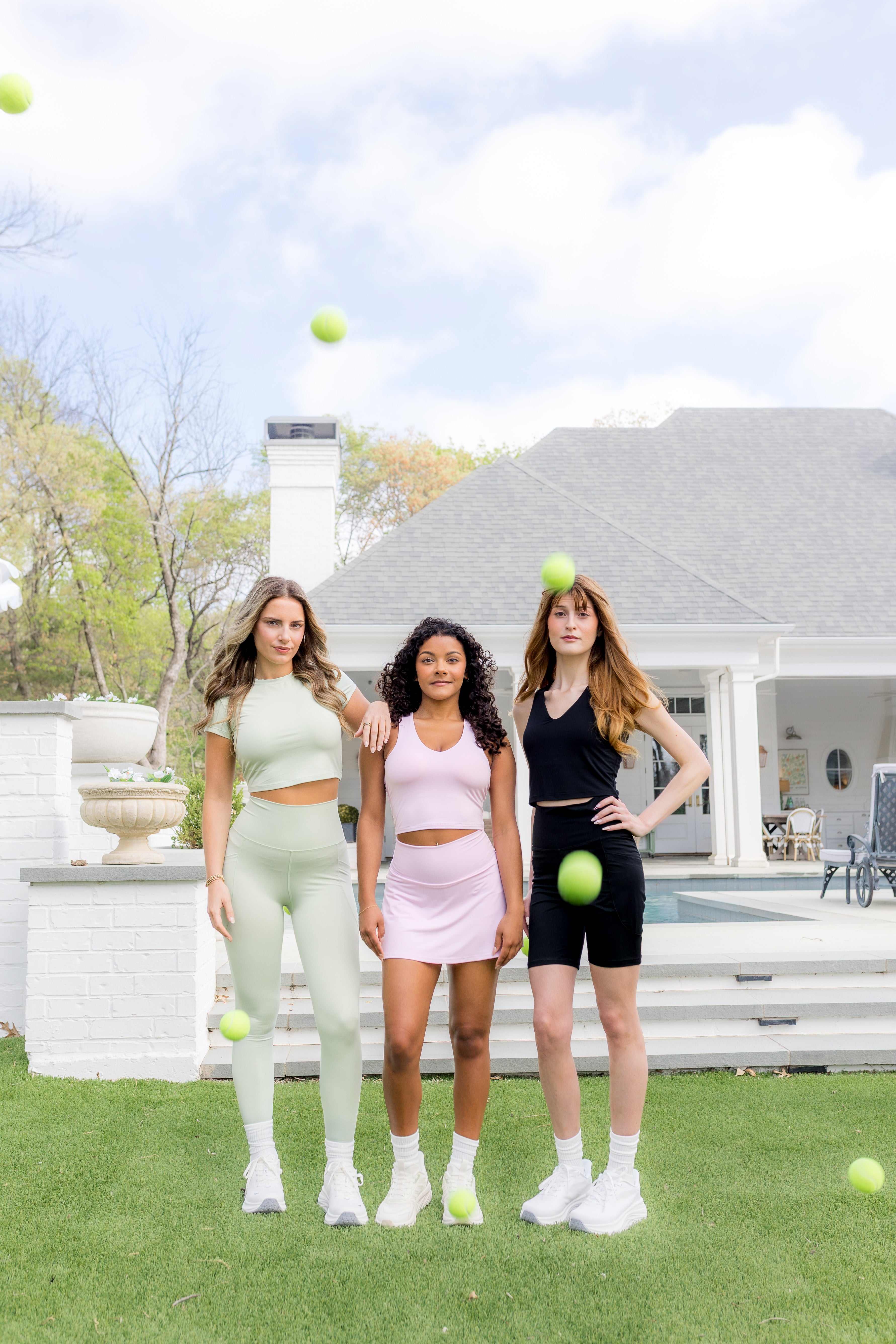 Models standing together wearing the Spring Bamboo Flex sets in Basil, Thistle and Midnight