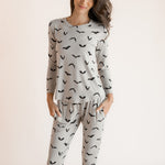 Modal posing in Women's Jogger Pajama Set in Bats print on a white background