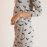 Close up of Modal wearing Women's Jogger Pajama Set in Bats print on a white background