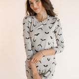 Modal smiling in Women's Jogger Pajama Set in Bats print on a white background