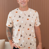 Smiling male model wearing the Kyte Men's Crew Neck in Bewitched paired with black pants