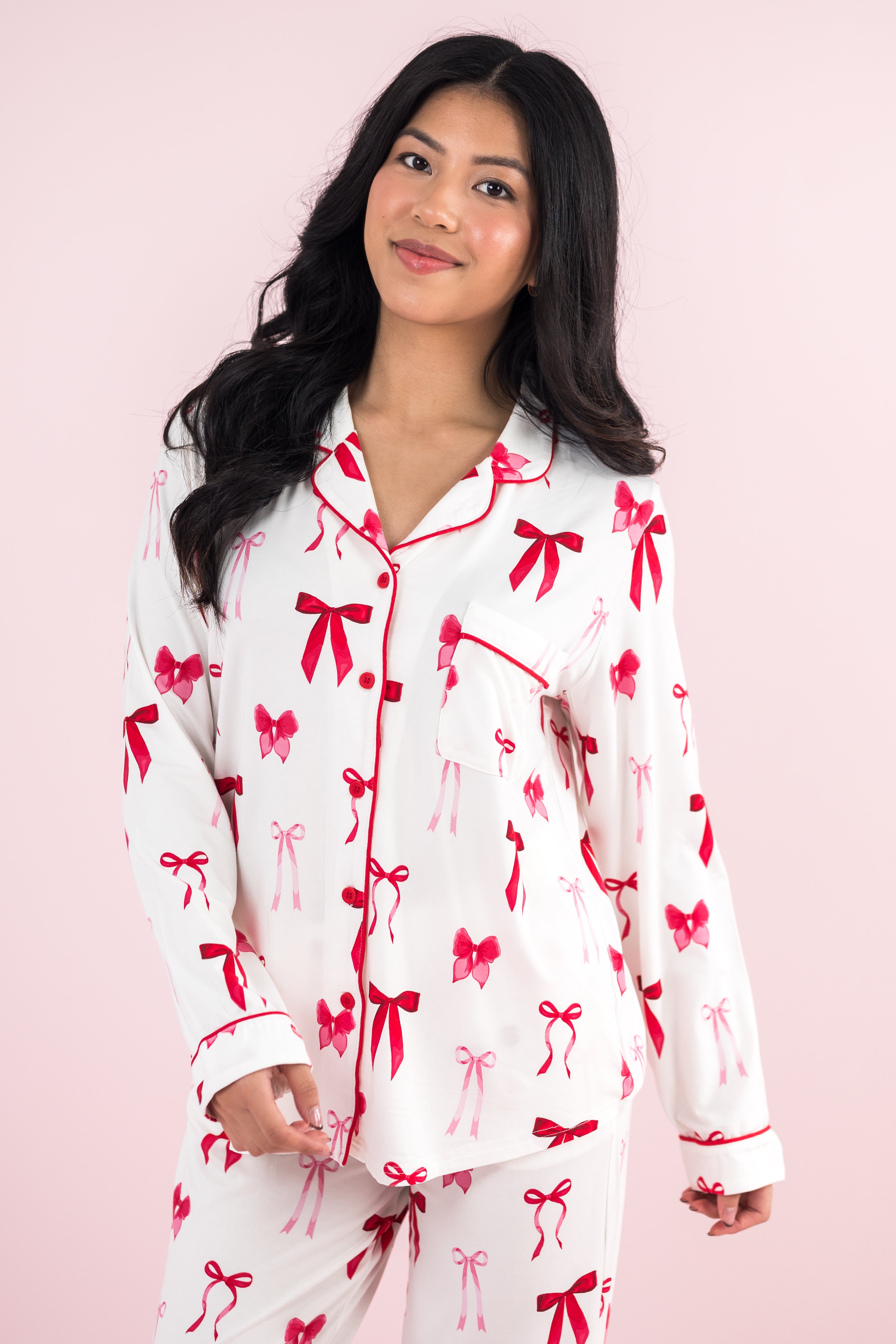 Close up of a model wearing the Bamboo Long-Sleeved Women's Pajama Set in Big Love Bow