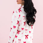 Model showing the back of the Kyte Bamboo Long-Sleeved Women's Pajama Set in Big Love Bow