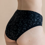 Close up of the back side of the Women’s Underwear in Midnight Leopard on a model 