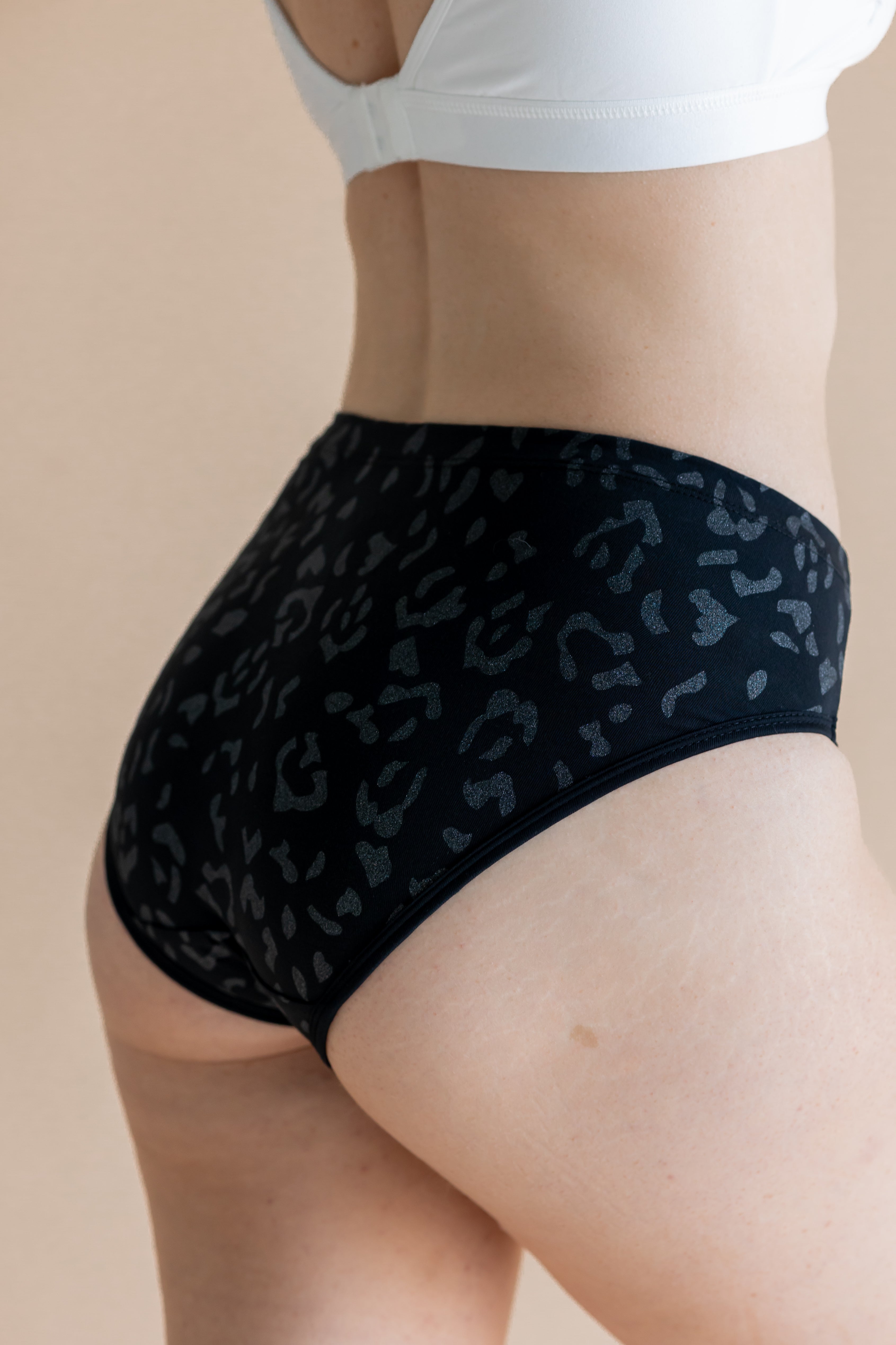 Close up of the back side of the Women’s Underwear in Midnight Leopard on a model 