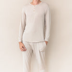 Male model wearing the Men's Ribbed Henley Set in Bisque in front of a cream colored background