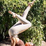 Female model doing yoga wearing the Bamboo Flex Women’s Leggings in Bisque