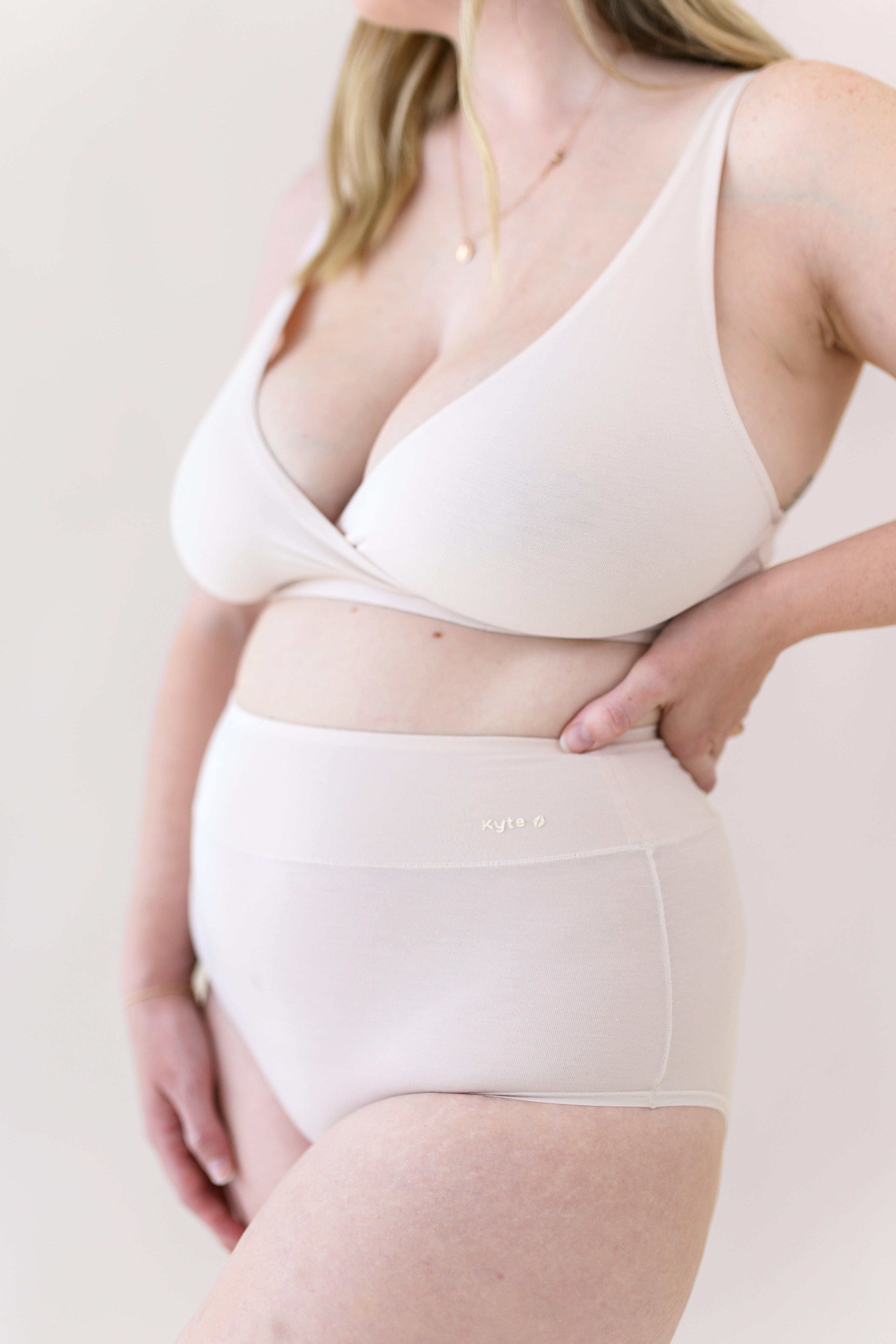 Woman modeling Women's High-Waisted Brief in Blonde and Cross Front Bralette