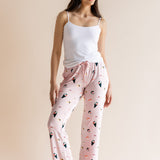 Model wearing pink Women's Lounge Pants in Sushi print under white camisole on a beige background ::: Model is 5'10" wearing size S ///