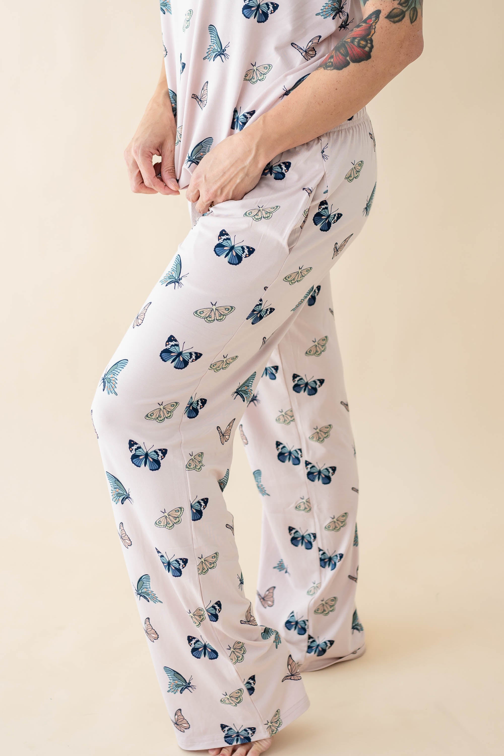 Side view of a model wearing the Women's Lounge Pants in Blush Butterfly
