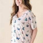 Female model wearing the Women's Relaxed Fit V-Neck in Blush Butterfly