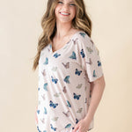 Female modeling the Women's Relaxed Fit V-Neck in Blush Butterfly