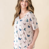 Female modeling the Women's Relaxed Fit V-Neck in Blush Butterfly