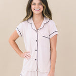 Woman modeling Women’s Short Sleeve Pajama Set in Blush with Midnight Trim with hand on hip