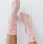 Adult Scrunch Socks in Blush shown on a model