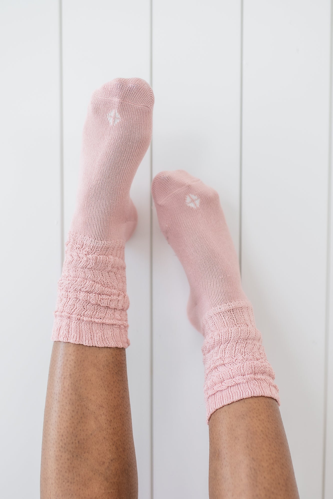 Adult Scrunch Socks in Blush shown on a model